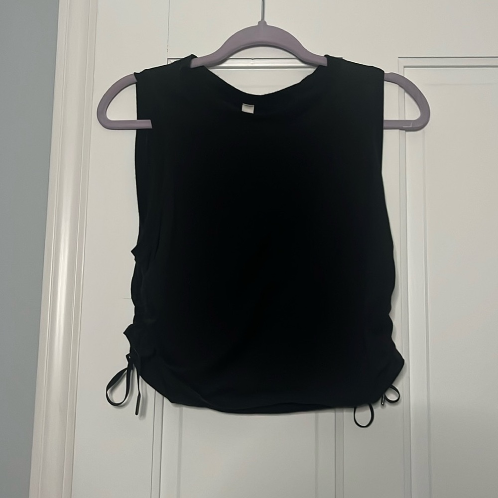 black lululemon tank top with adjustable ties on the sides